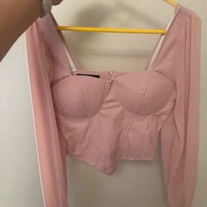 Pink poofy sleeved crop top; corset style